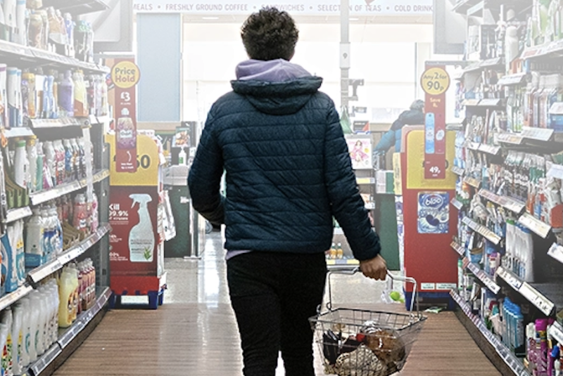 Young man in a grocery store