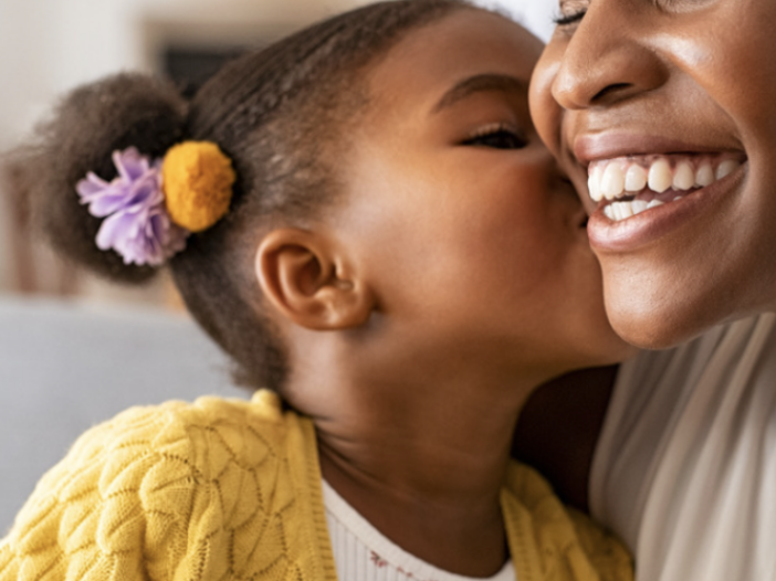 Mother and child hugging