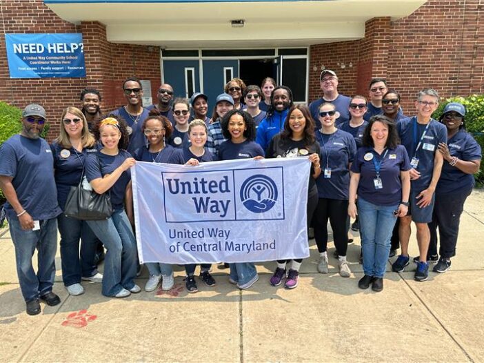 WJZ group photo holding a united way of central maryland Sogn
